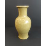 A 19th century Chinese ceramic vase decorated in a celadon glaze (38cm high)