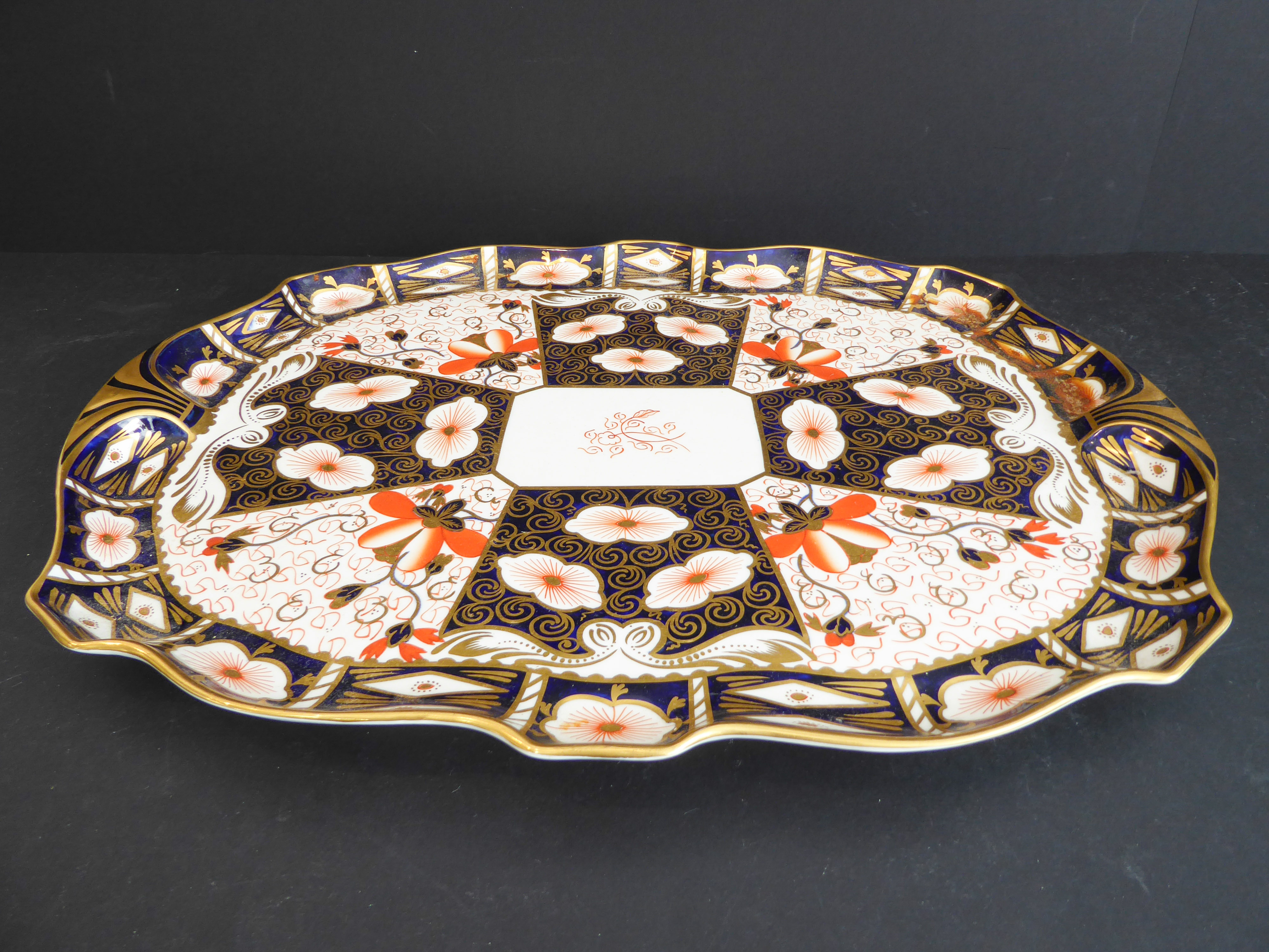 A large Royal Crown Derby porcelain serving tray: hand-gilded and decorated in the Imari palette (