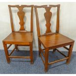 A pair of 18th century elm side chairs with solid seats and vase-shaped splats