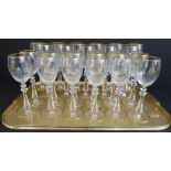 A set of very fine 11 large (21.5m high) and 12 small (20cm high) Baccarat wines with gilded rims,