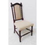 A mid-19th century rosewood bedroom-style nursing chair of fine quality: arched top rail above two