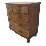 A 19th century bow-fronted mahogany chest: two half-width above three full-width graduated drawers