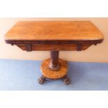 A William IV / Victoria rosewood foldover-top card table: turned stem and circular base with paw-