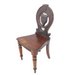 A mid-19th century walnut hall chair: carved oval back with central fox-mask-style back above