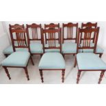 A set of eight early 20th century oak dining chairs with carved Art-Nouveau-style top rails and