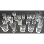 An assortment of 24 quality drinking glasses to include cut and etched glass, short sets and