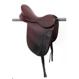 A brown leather pony dressage saddle made by G. Barnes & Son, Malmesbury