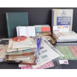 A large box of GB and world stamps including several albums. To include stamps from Canada, IoM mint