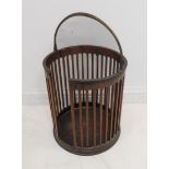A George III period circular pierced mahogany plate bucket with original swing-handle (32.5cm