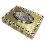 An 18-carat gold pill box with engine-turned cover with inset oval miniature painting, bordered by