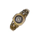 A cushion-shaped old brilliant-cut diamond ring collet set above the pierced and engraved tapering