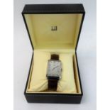 A gentleman's dress wristwatch in Art Deco style: vertical rectangular steel case surrounding the