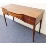 A 19th century mahogany sideboard of small and pleasing proportions: central large bow-fronted