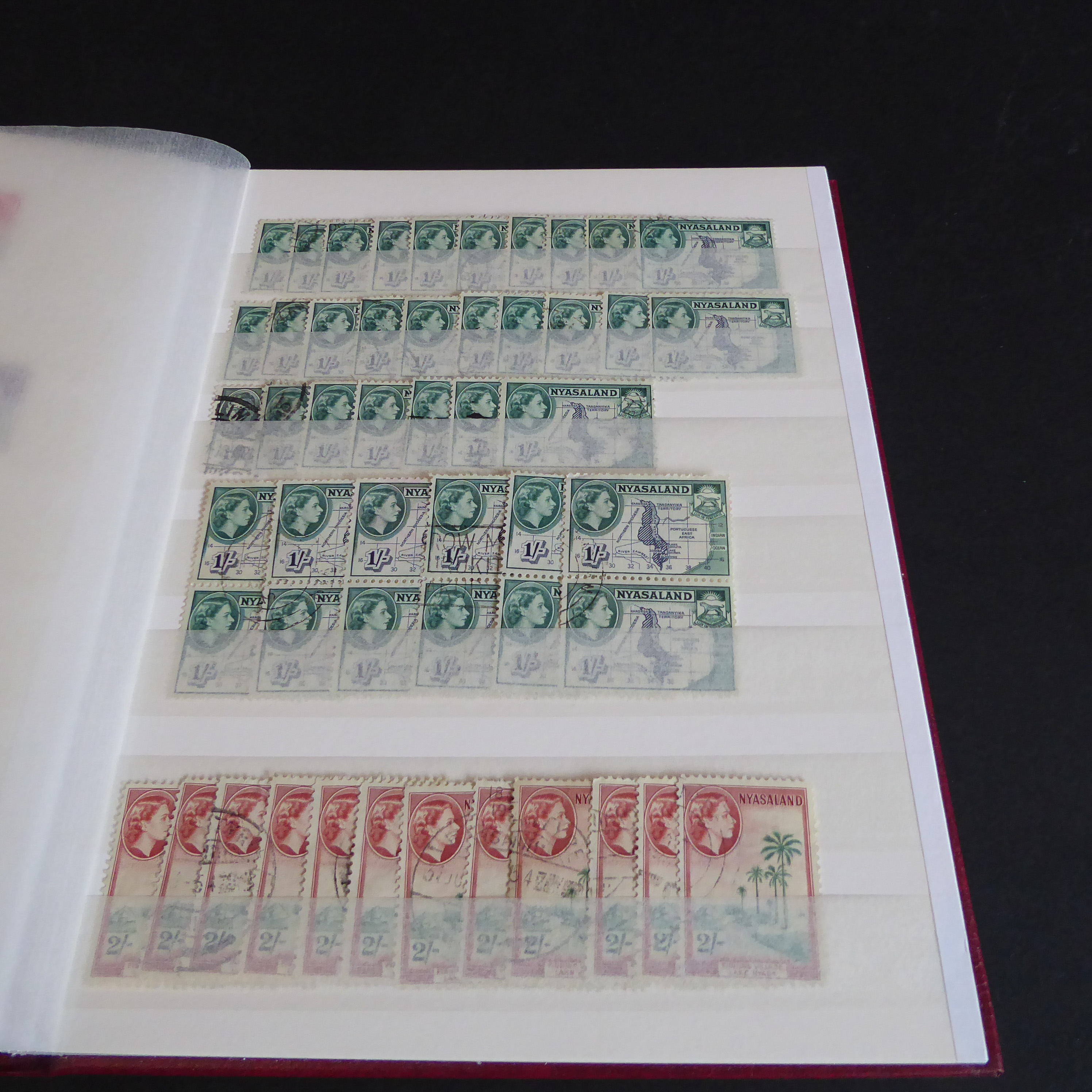 A Stanley Gibbons stockbook containing stamps of Nyasaland (more than 1,000 stamps with some - Image 12 of 14