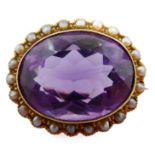 A late 19th century/early 20th century amethyst, half pearl and 15-carat yellow gold brooch, the