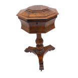 A late Regency or early Victorian rosewood teapoy of octagonal form: the hinged domed cover