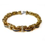 A sapphire and diamond-set flexible link design bracelet: each figure of eight link centrally set