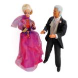 A unique pair of late 20th century boxed Barbie and Ken dolls designed by Mattel's senior