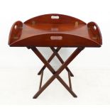 A 19th century oval mahogany butler's tray on stand: the tray with hinged ends and sides and four