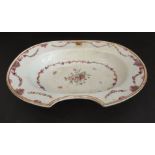 An 18th century Chinese porcelain barber's bowl of oval form (old damage and restorations):