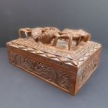 An early/mid 20th century Chinese rectangular hardwood box and cover: the hinged lid profusely