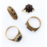 Four 9-carat yellow gold garnet-set rings: a tiered cluster; a cluster with seed pearl border; an