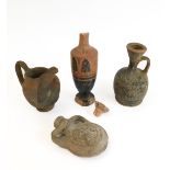Four pieces of early terracotta pottery comprising: a blackware vase decorated with stylised