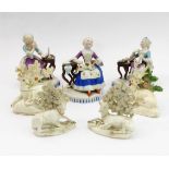 A set of three 19th century hand-decorated continental porcelain figure models: the centre as a lady