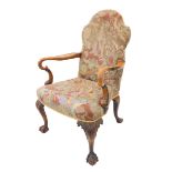 A good early 18th century style (later) open-armed library chair: the finely hand-stitched and