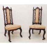 A pair of 19th century rosewood prie-dieu style low nursing chairs: padded backs flanked by C-scroll