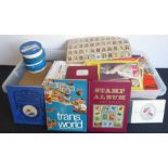 An assortment of world stamps in tins, boxes and albums