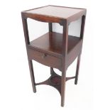 A George III period mahogany bedside table: short galleried top above a central full-width drawer