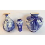 A Royal Doulton group of three late 19th and early 20th century blue and white vases, each with