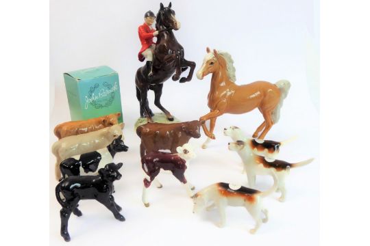 Eleven pieces by Beswick: huntsman on a rearing horse (868); three foxhounds (one boxed), palomino - Image 1 of 13