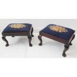 A pair of early 20th century walnut framed stools in earlier 18th century style: each with floral