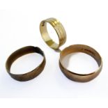 An 18-carat yellow gold engraved wedding band (ring size M/N, weight 3.7g), together with two 9-