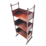 A three-tier Edwardian mahogany bookstand of small proportions on turned and block uprights (34.