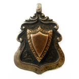 A WWI gold-coloured shield mounted presentation pendant engraved to the reverse ''G'. Coy 3 RD BN