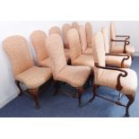 A very good and long set of twelve (10+2) early 18th century style upholstered and walnut armchairs: