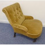 A late 19th century buttonback upholstered low nursing chair on turned front legs terminating in