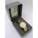 A gentleman's cased Longines' Conquest' steel and gold-plated, mounted dress wristwatch: the white