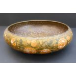 A papier-mâché bowl hand-gilded and decorated with flowers to the exterior (probably Indian late