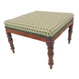 A mid-19th century mahogany-framed and upholstered foot-stool raised on turned tapering legs (56