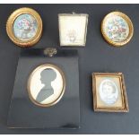 A mid-19th century framed and glazed oval portrait miniature silhouette of a young girl, signed '