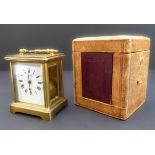 A late 19th to early 20th century brass and glass-sided carriage clock of small proportions: the