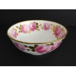 An early 20th century George Jones ceramic bowl: hand-gilded and decorated with pink roses in