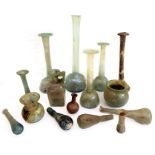 A good and interesting selection of Roman glassware to include tall vases (mostly with iridescence),