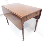 An early 19th century mahogany Pembroke table: single end-drawer, dummy drawer opposing and