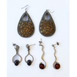 A large pair of baluster-shaped silver earrings: each set with many hand-cut oval citrines