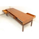 Probably PETER HAYWOOD for VANSON - a stylish mid-20th century rosewood coffee table: three frieze